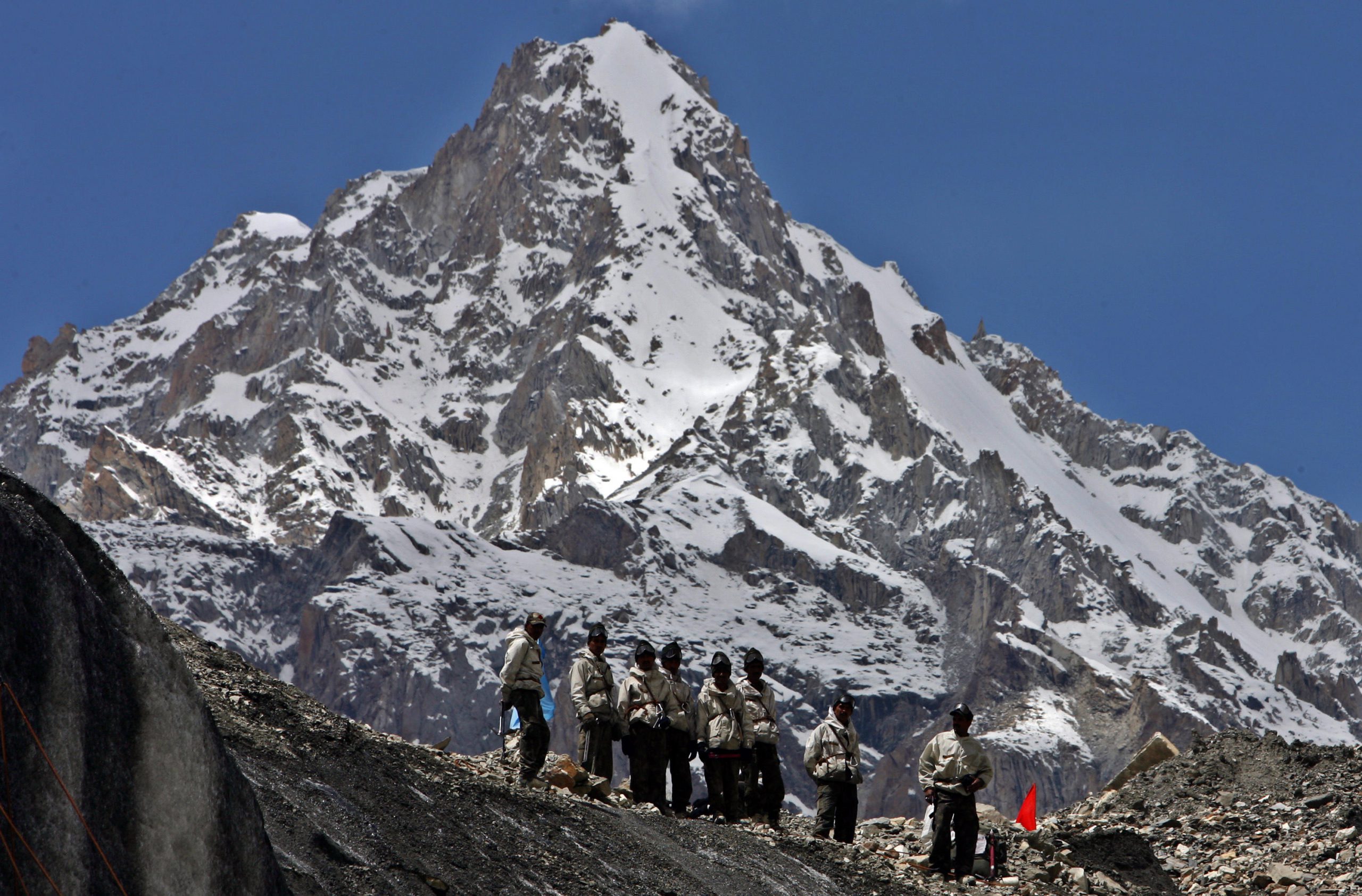 <p>Indian Army soldiers stand at a glacier near base camp of Siachen, India. Image source: UPI / Alamy</p>