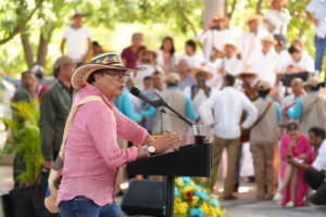 Gustavo Petro behind podium with crowd in background